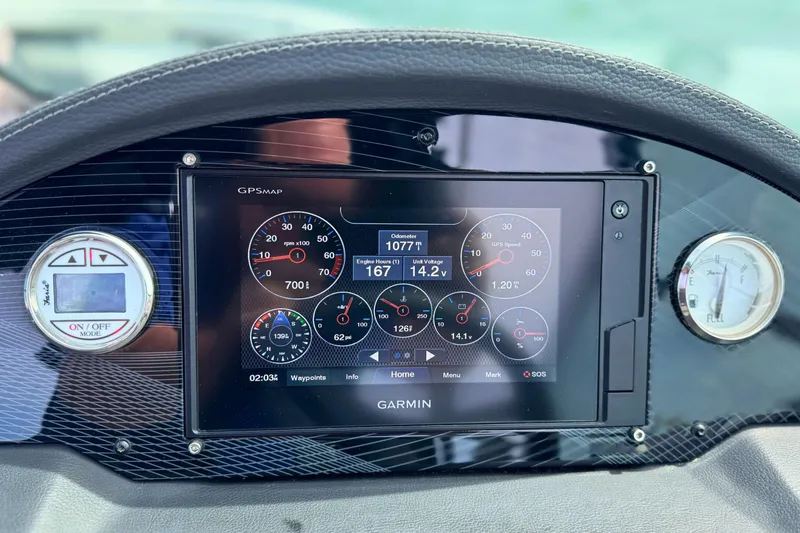 Slide: The Image of Dashboard of a 2019 Regal 21 OBX boat with Garmin GPS display. - 27
