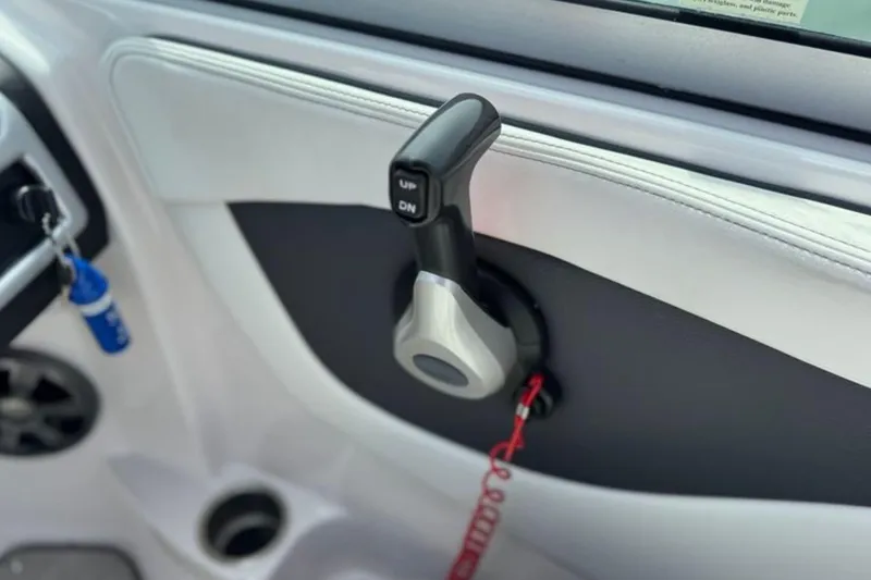 Slide: The Image of Throttle control lever on a 2019 Regal 21 OBX boat interior. - 28