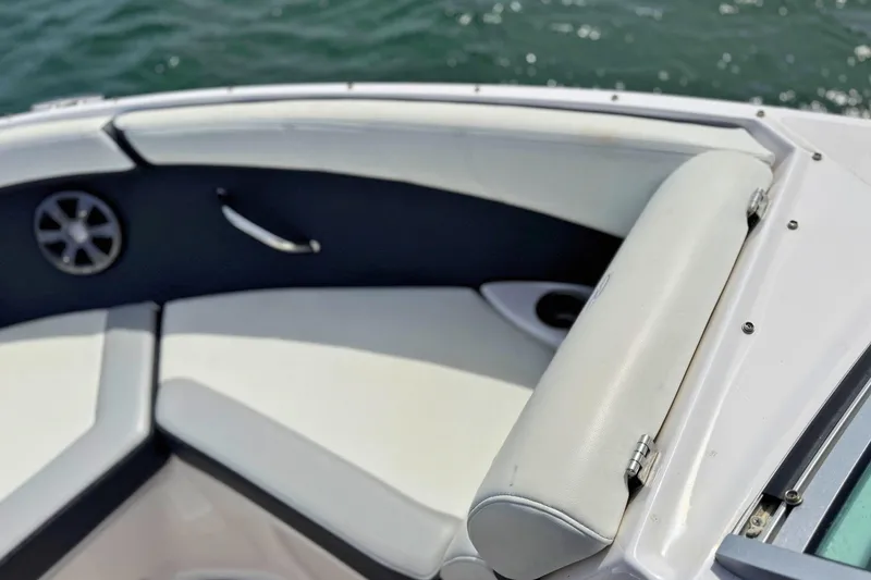 Slide: The Image of Bow seating area of a 2019 Regal 21 OBX boat with white upholstery. - 30