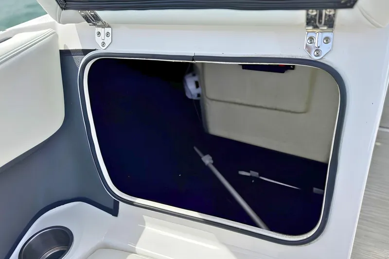 Slide: The Image of Open storage compartment on a 2019 Regal 21 OBX boat. - 31