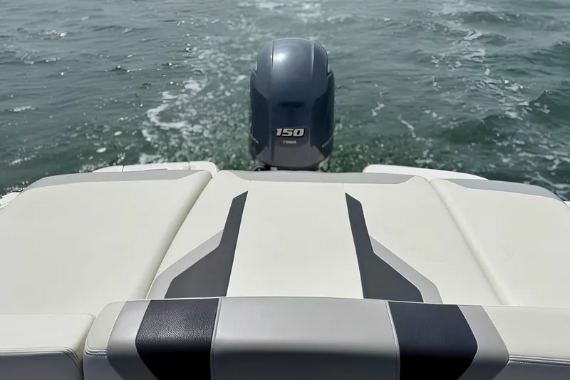 Slide: The Image of 2019 Regal 21 OBX boat with Yamaha 150 outboard motor on water. - 9