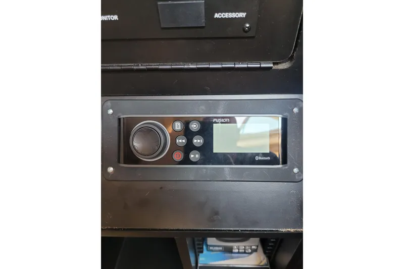Slide: The Image of Fusion Bluetooth stereo system on 2004 Searay 280 Sundancer boat dashboard. - 15