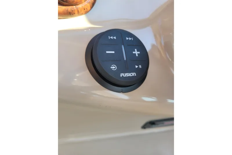 Slide: The Image of Fusion audio control panel on 2004 Searay 280 Sundancer boat dashboard. - 16