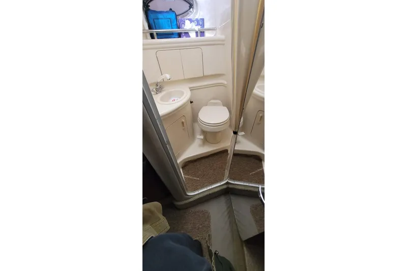 Slide: The Image of 2004 Sea Ray Sundancer 280 bathroom interior with sink and toilet. - 23