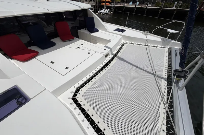 Slide: The Image of Leopard 40 catamaran deck with seating and netting, 2020 model, docked at marina. - 17