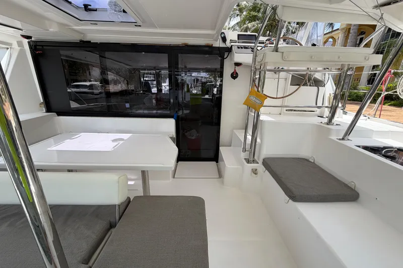 Slide: The Image of Interior view of a 2020 Leopard 40 catamaran, featuring seating and navigation area. - 20
