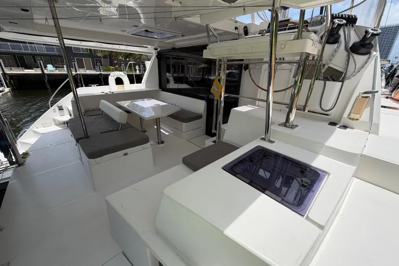Slide: The Image of Spacious deck of a 2020 Leopard 40 catamaran with seating and dining area. - 22