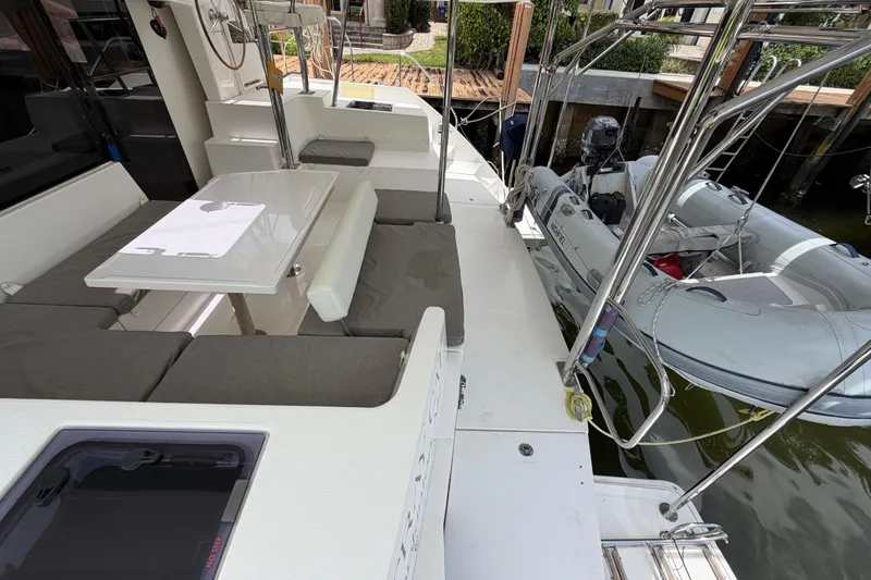 Slide: The Image of Leopard 40 catamaran deck with seating area and docked inflatable boat, 2020 model. - 26