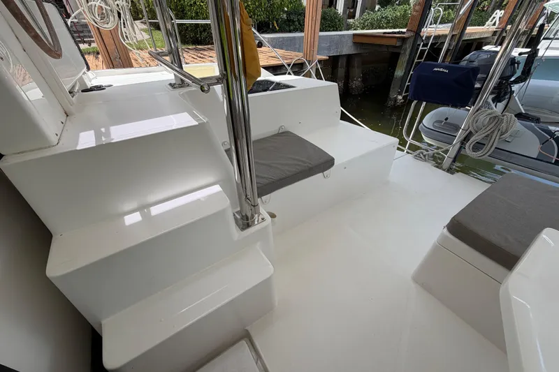 Slide: The Image of Catamaran deck with seating and steps, Leopard 40 model, 2020, docked by the water. - 28
