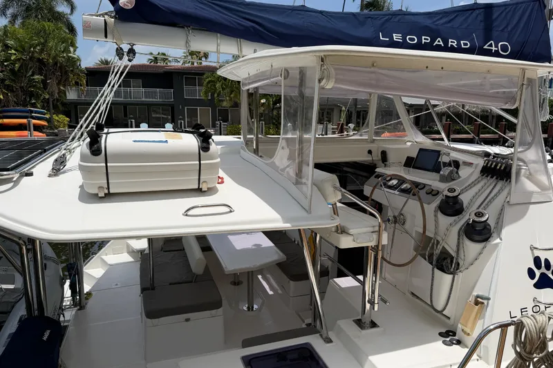 Slide: The Image of Leopard 40 catamaran cockpit with navigation equipment, seating, and storage, 2020 model. - 29