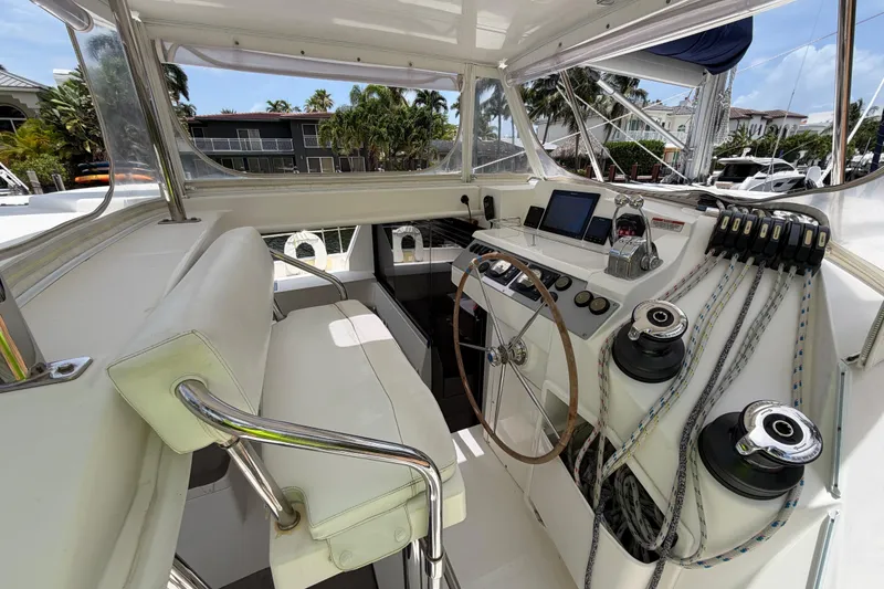 Slide: The Image of Cockpit of a 2020 Leopard 40 catamaran with steering wheel and navigation equipment. - 30