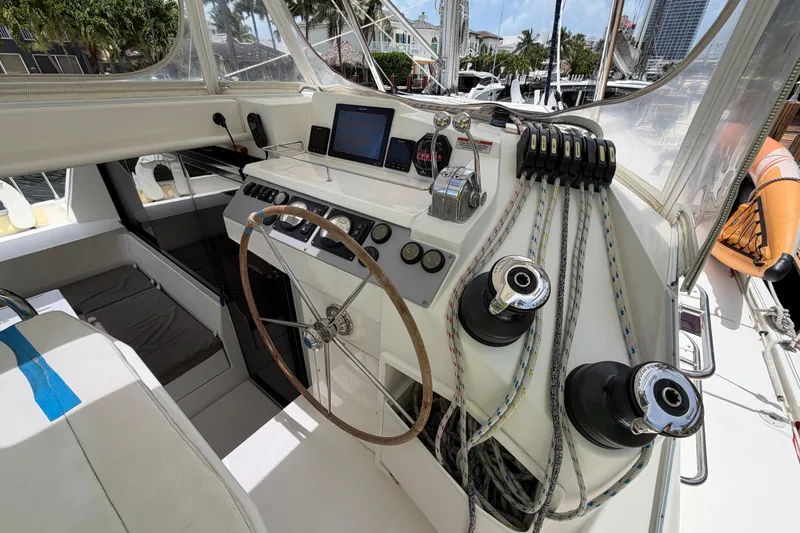 Slide: The Image of Helm of 2020 Leopard 40 catamaran with steering wheel, navigation equipment, and winches. - 32