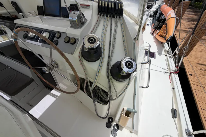 Slide: The Image of Steering wheel and control panel on a 2020 Leopard 40 catamaran deck. - 33