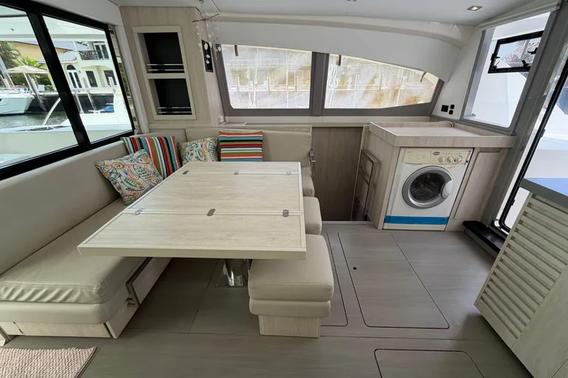 Slide: The Image of Modern interior of 2020 Leopard 40 catamaran with dining area and washing machine. - 37