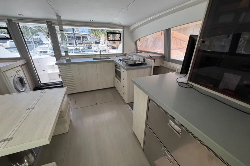 Slide: The Image of Modern kitchen interior on a 2020 Leopard 40 yacht, featuring sleek cabinetry and appliances. - 38