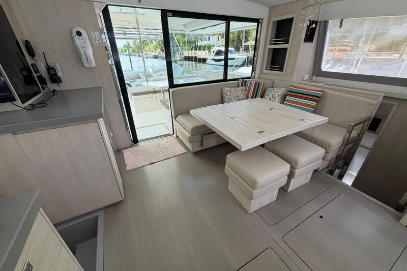 Slide: The Image of Interior of a 2020 Leopard 40 catamaran with modern dining area and colorful cushions. - 39