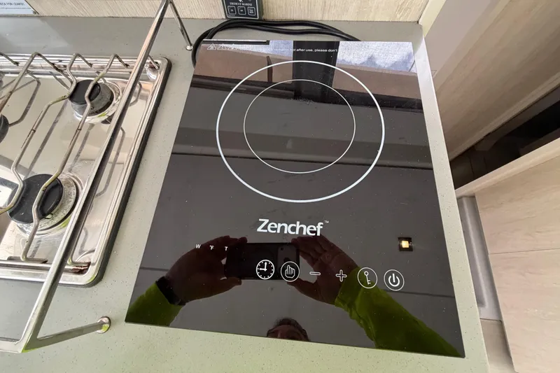 Slide: The Image of Modern Zenchef induction cooktop on Leopard 40 yacht, 2020 model, with adjacent gas stove. - 47