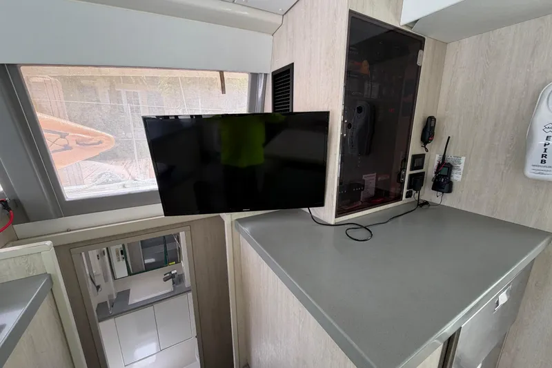 Slide: The Image of Interior of 2020 Leopard 40 catamaran with mounted TV and navigation equipment. - 50