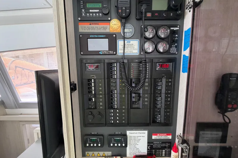 Slide: The Image of Electrical control panel inside a 2020 Leopard 40 catamaran, featuring gauges and switches. - 53