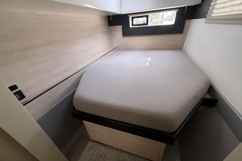 Slide: The Image of Compact cabin interior of a 2020 Leopard 40 catamaran with a cozy bed. - 57