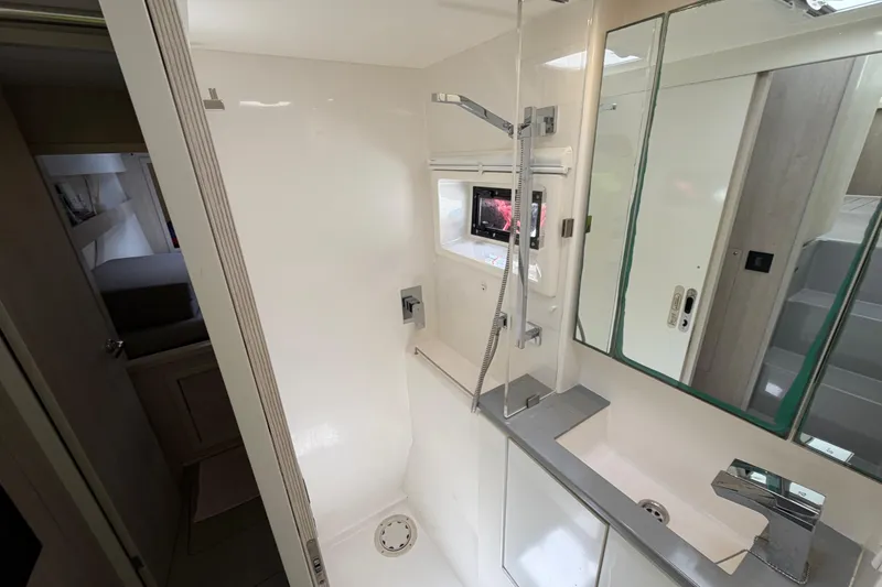 Slide: The Image of Modern bathroom interior in a 2020 Leopard 40 yacht, featuring sleek fixtures and mirrors. - 67