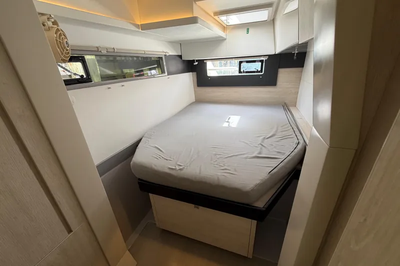 Slide: The Image of Interior cabin of 2020 Leopard 40 catamaran with bed and windows. - 70