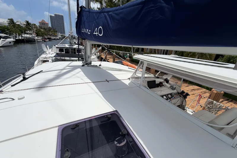 Slide: The Image of 2020 Leopard 40 catamaran docked, featuring sleek design and spacious deck. - 73