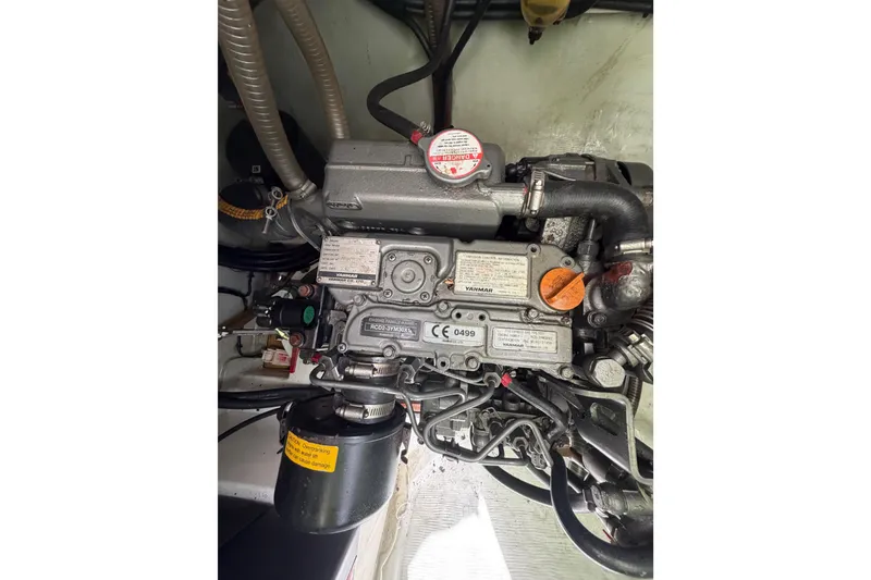 Slide: The Image of Engine compartment of a 2020 Leopard 40, showcasing detailed mechanical components. - 84