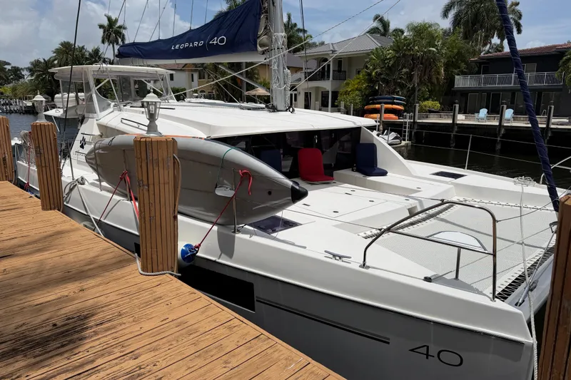 Slide: The Image of Catamaran Leopard 40 docked, featuring sleek design and spacious deck, 2020 model. - 9