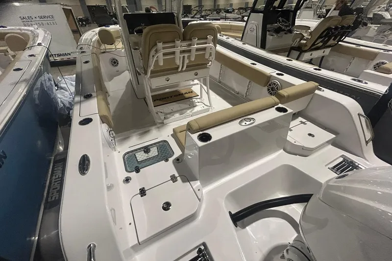 Slide: The Image of 2026 Sportsman Heritage 231 Center Console boat interior with seating and console features. - 4