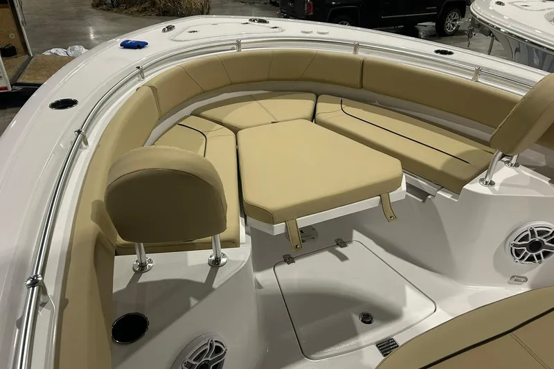 Slide: The Image of 2026 Sportsman Heritage 231 Center Console boat with tan seating and modern design. - 6