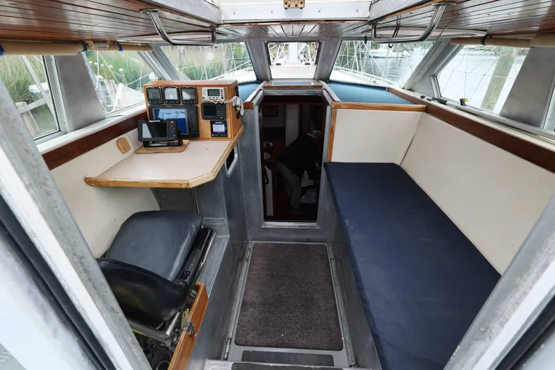 Slide: The Image of Interior of 1998 Limited Edition Hike Metal boat with navigation equipment and seating area. - 12