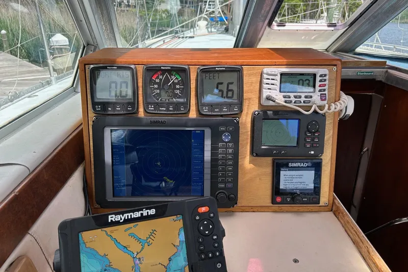 Slide: The Image of Boat navigation dashboard with Raymarine and Simrad equipment, Limited Edition Hike Metal, 1998. - 13