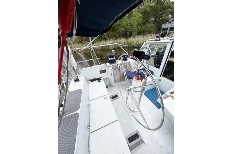 Slide: The Image of Cockpit of 1998 Limited Edition Hike Metal boat with steering wheel and canopy. - 15