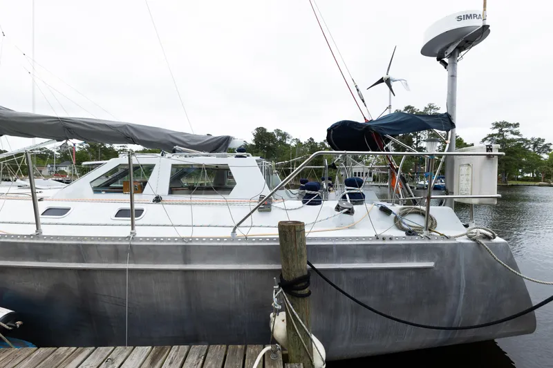 Slide: The Image of Limited Edition 1998 Hike Metal yacht docked at a marina, featuring sleek design and modern equipment. - 20