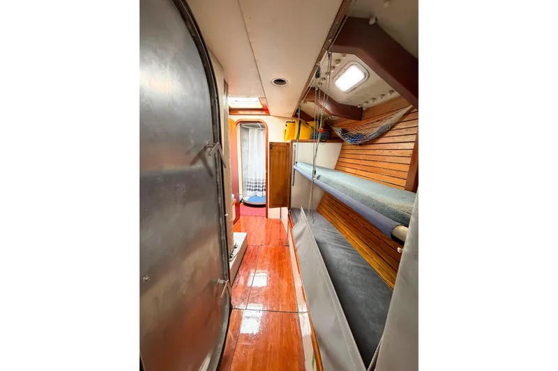 Slide: The Image of Interior of 1998 Limited Edition Hike Metal boat with wooden flooring and bunks. - 8
