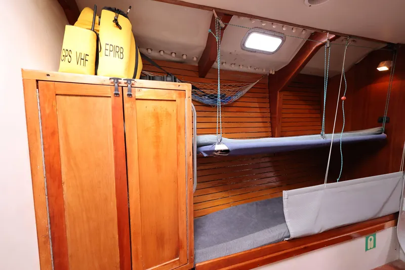 Slide: The Image of Interior of 1998 Limited Edition Hike Metal boat with wooden cabinets and bunk beds. - 9