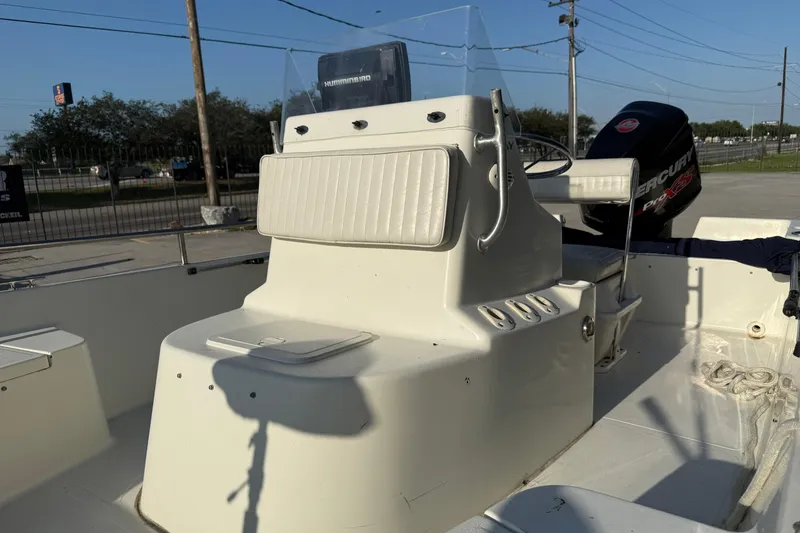 Slide: The Image of 2006 Sea Boss 21 Bay Boat interior with steering console and Mercury Pro XS engine. - 10
