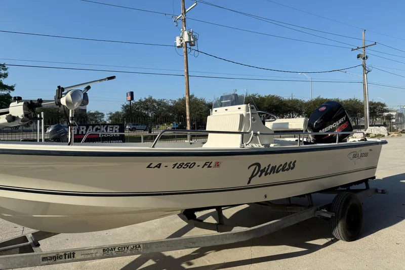 Slide: The Image of 2006 Sea Boss 21 Bay Boat named "Princess" on trailer, featuring Mercury engine. - 5
