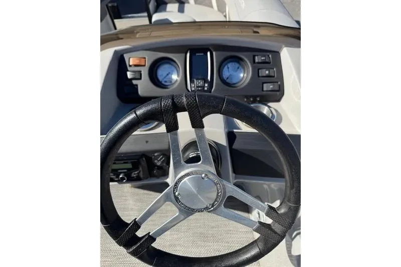 Slide: The Image of Steering wheel and dashboard of 2023 Bennington 23 SX boat. - 10