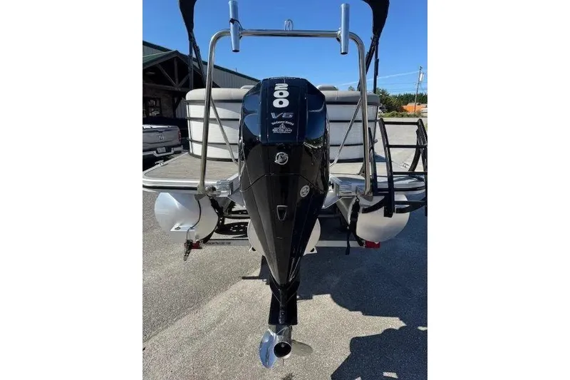 Slide: The Image of 2023 Bennington 23 SX boat with a powerful 200 V6 outboard motor. - 3