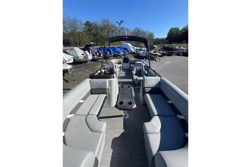 Slide: The Image of 2023 Bennington 23 SX pontoon boat with spacious seating and modern design. - 4