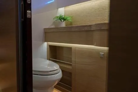 Slide: The Image of Modern bathroom in 2022 Horizon PC65 yacht with sleek design and ambient lighting. - 100
