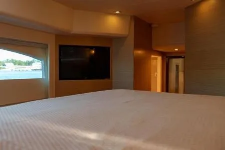 Slide: The Image of Luxurious interior of 2022 Horizon PC65 yacht with modern amenities and large window view. - 103