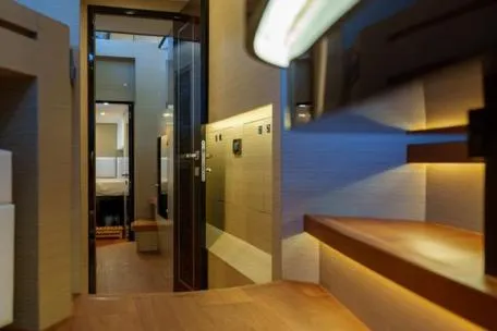 Slide: The Image of Luxurious interior of 2022 Horizon PC65 yacht with modern lighting and wooden accents. - 104