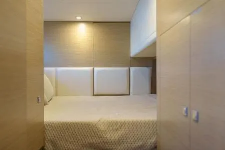 Slide: The Image of Luxurious cabin interior of 2022 Horizon PC65 yacht with modern design and cozy bedding. - 105