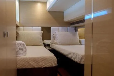 Slide: The Image of Interior of 2022 Horizon PC65 yacht with twin beds and modern decor. - 106