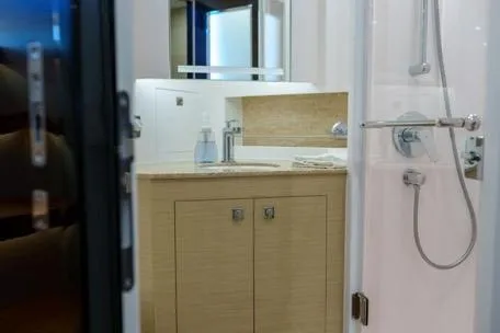 Slide: The Image of Modern bathroom interior on Horizon PC65 yacht, 2022 model, featuring sleek fixtures and cabinetry. - 108