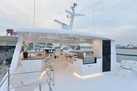 Slide: The Image of Luxurious 2022 Horizon PC65 yacht deck with modern amenities and sleek design. - 13