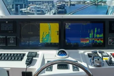 Slide: The Image of Helm of 2022 Horizon PC65 yacht with navigation screens and controls. - 14